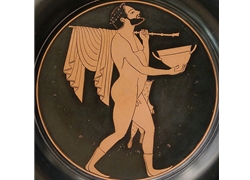 Bearded Komast with a Skyphos, a staff and pipes case; Tondo of an Attic Black-Figure Plate